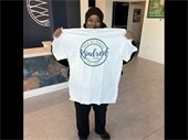 People First Program Participant showcasing Kindred community shirt